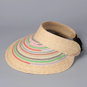 Detail view of woven raffia sun visor with colorful stripes and adjustable back strap