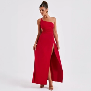 Detail of red one-shoulder dress featuring waist cut-out and high slit evening gown