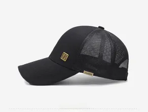 Side view of black mesh baseball cap featuring a golden metal logo and classic label