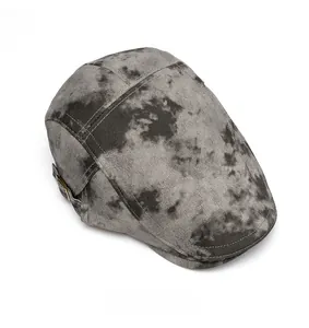 Top down view of a vintage grey tie-dye ivy cap with adjustable metal side buckle
