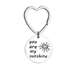 Polished stainless steel sun keychain engraved with You Are My Sunshine message