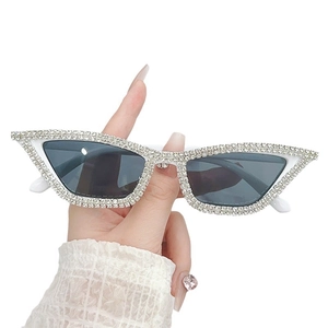 Classic white cat-eye sunglasses with hand-set silver rhinestones and grey lenses