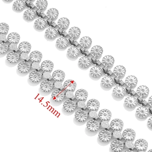 Macro detail of 14.5mm silver metal flower disc links for heavy-duty hip hop chains