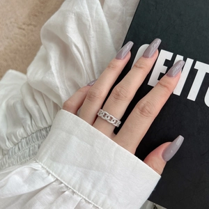 Detailed view of an open-link S925 sterling silver ring with pavé-set cubic zirconia