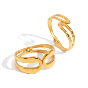 Detail showing the polished 18K gold-plated double-layer spring bangles with wave design
