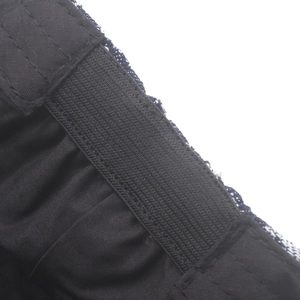 Macro view of elastic waistband detail and blue-white tweed fabric stitching on the cap