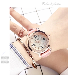 Close-up of pink leather watch set with rose gold rhinestones and matching jewelry