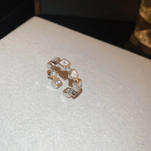 Detail of silver butterfly zircon open ring with geometric crystal settings and polished finish