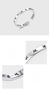 Detail of S925 sterling silver ring showing hollow stars and polished mirror surface