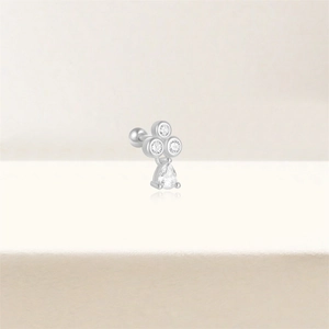 Detail of s925 silver stud earring with three round zircons and a teardrop pendant