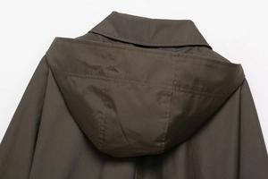Detailed view of the dark brown waterproof trench coat hood and neckline structure