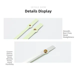 Macro view of polished copper quartz clock hands showing smooth finish and brass sleeve