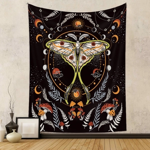 Detail of bohemian tapestry featuring moon moth, celestial moon phases and forest mushrooms