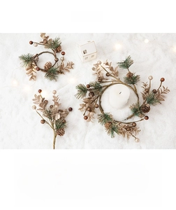 Close-up of golden pine cones and green needles on a luxury Christmas wreath branch