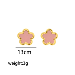 Detail view of pink petal flower earrings with golden dots, 13cm size and 3g weight