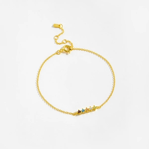 Macro detail of S925 silver gold bracelet featuring five colorful zircon stone settings