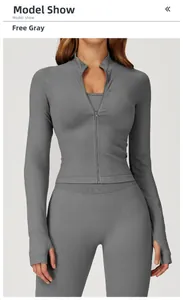 Detail of gray seamless yoga jacket with thumbholes and matching high waist leggings