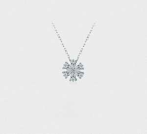 Detailed view of S925 silver flower pendant with pear-cut zircon and fine O-chain