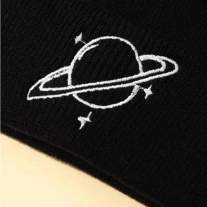Classic black ribbed knit beanie with white Saturn embroidery for winter warmth