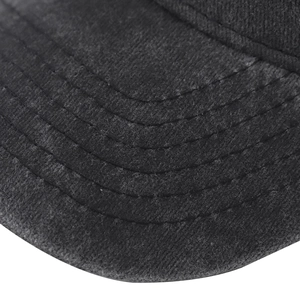 Detailed close-up of washed cotton baseball cap brim with precise six-row stitching