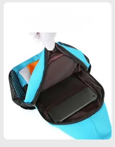 Detail view of multi-functional sky blue chest bag showing internal compartment with phone