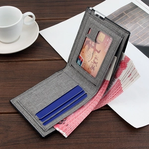 Gray fabric texture bifold wallet for men with multi-card slots on dark wooden table