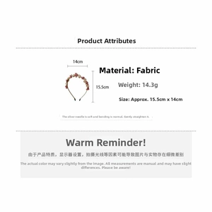 Detailed view of floral headband with 14.3g weight and 15.5cm by 14cm dimensions