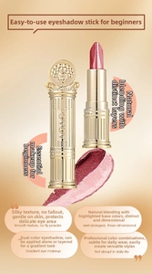 Detail of dual-color shimmer eyeshadow stick with luxury golden embossed casing