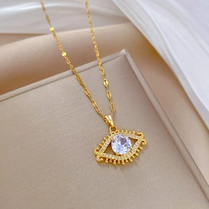 Detailed close-up of a gold-plated titanium evil eye necklace with sparkling zirconia
