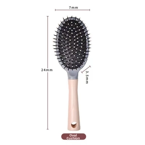 Detailed view of pink oval cushion hairbrush with dimensions 24cm height and 7cm width
