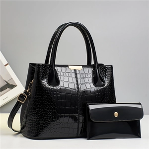 Chic black crocodile pattern handbag set with crossbody strap and matching wallet