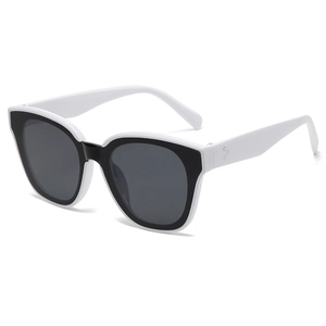 Modern black and white oversized sunglasses with metal rivets shown from 45-degree angle