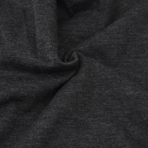 Close-up of soft dark gray knitted fabric texture showing premium thermal material quality