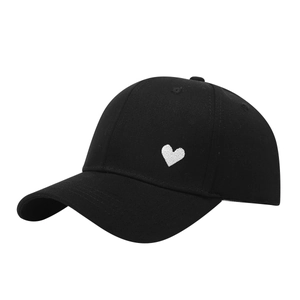 Classic black cotton baseball cap with white heart embroidery and curved sun visor