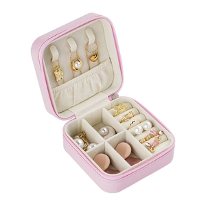 Pink portable travel jewelry box for necklaces, rings, and earrings in a compact design