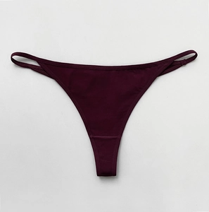 Detail view of deep purple cotton thong with sexy thin straps and athletic knit texture