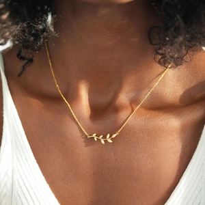 Elegant S925 sterling silver gold necklace featuring olive leaf pendant with fine crystals