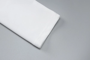 Close-up of high-quality white fabric cuff showing detailed texture and stitching