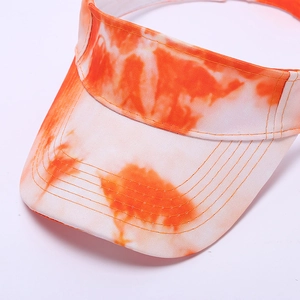Close-up of orange and white tie-dye sun visor featuring reinforced stitching on the brim
