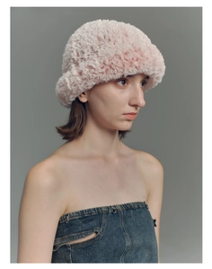 Detailed texture of pink faux fur bucket hat with soft plush finish for women