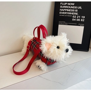 Detail of Westie plush bag featuring red plaid fabric and adjustable shoulder strap