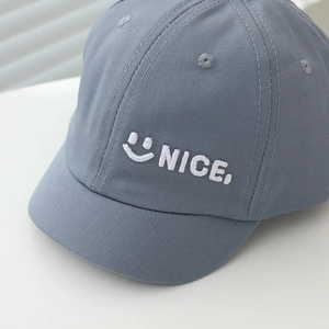 Blue cotton baby baseball cap with white Nice embroidery and a cute smiley face