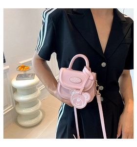 Pink mini crossbody bag for women with cute bear pendant and detachable strap