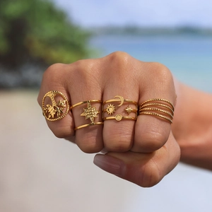 Set of 4 gold stainless steel rings with tree of life and celestial star moon motifs