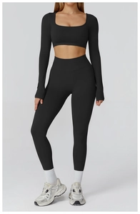 Detail view of high-elastic black yoga set with square neck top and high-waist leggings