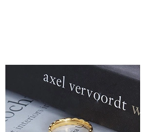 Macro detail of gold-plated titanium steel ring with U engraving on inner band