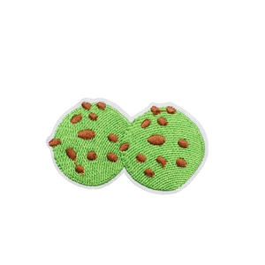 Green tiramisu cake embroidered patch with chocolate spots and white edge finish