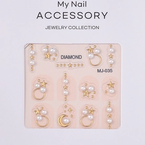 Minimalist gold star and pearl nail art charms set for manicure design on pink card