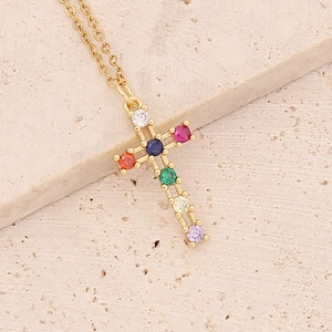 Close-up of 18K gold plated cross pendant with vibrant multi-color zircon stones
