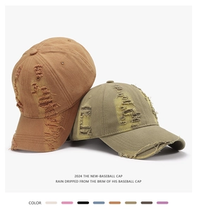 Detailed view of distressed cotton fabric with worn holes on vintage baseball caps